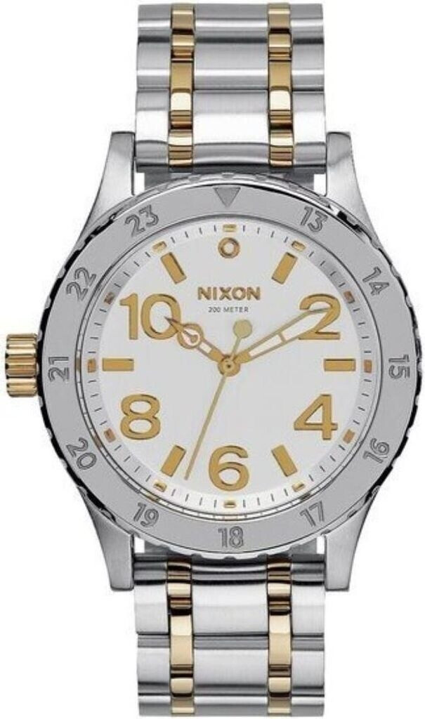 Die Nixon Uhr The 38-20 in Silber und Gold hat ein rundes Gehäuse und ein weißes Zifferblatt mit goldenen Ziffern und Zeigern.