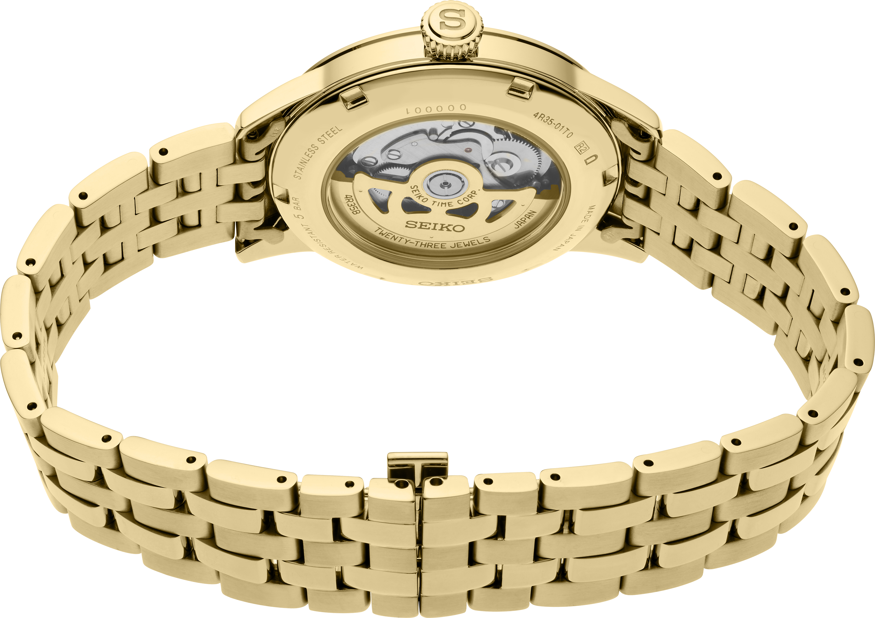 Ein goldenes Armbanduhr-Werk ist sichtbar durch den transparenten Gehäuseboden einer goldenen Armbanduhr mit einem Gliederarmband.